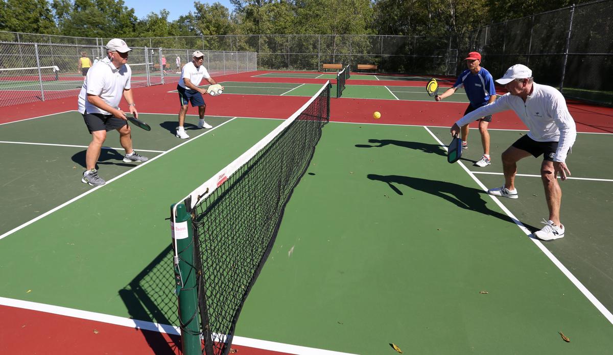 Dave Weinbach, of Madison, (back right) gold medalist in the 2016 US
