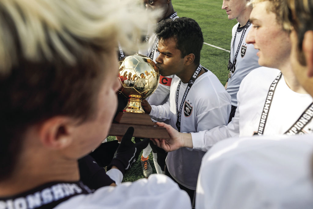 WIAA state boys soccer photo: A trophy worth smooching
