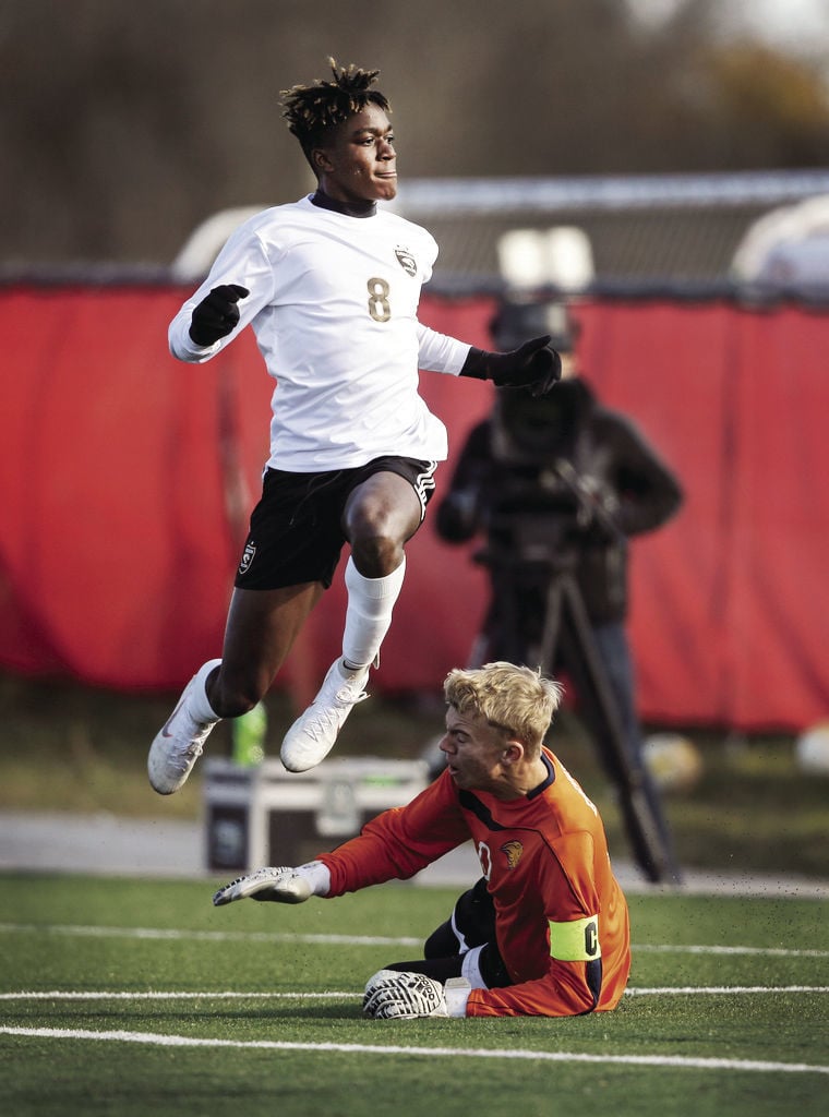 WIAA state boys soccer photo: Oregon's Madison Conduah jumps for joy after a score