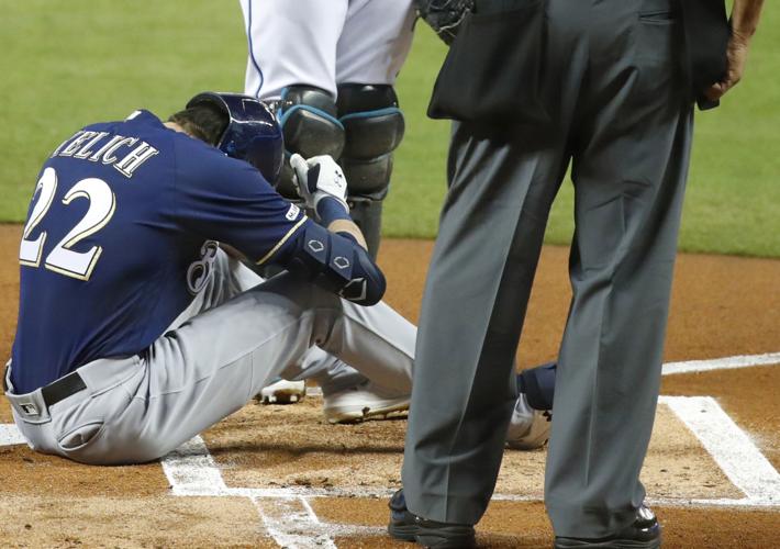 Christian Yelich fractures right knee cap on foul ball, will miss