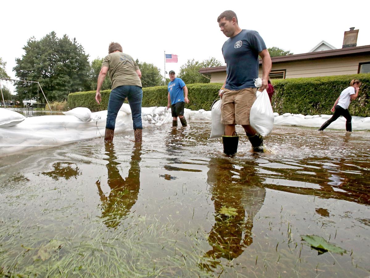 Bracing for second round of flooding: Rising lakes, closed roads and lots  of sandbags