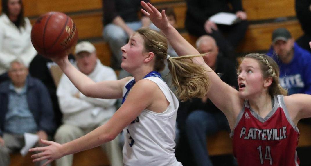 Prep girls basketball photo: Platteville's Josie Nies defends against Lake Mills' Julianna Wagner