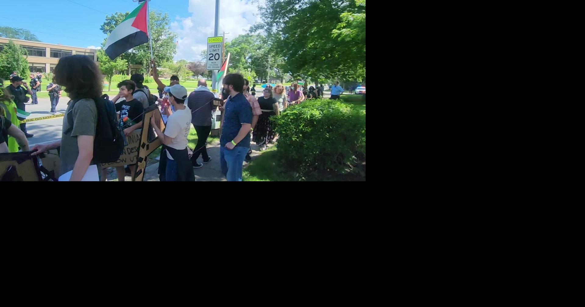 Protesters move down Sherman Street as Biden speaks inside