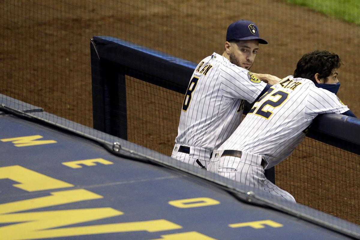 Milwaukee Brewers starter Corbin Burnes adjusts his hair as he pitches  against the Pittsburgh Pirates during the first inning of a baseball game,  Tuesday, Aug. 2, 2022, in Pittsburgh. (AP Photo/Keith Srakocic