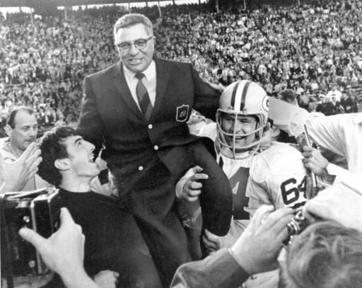 Coach Earl Curly Lambeau, right, just named coach of the Chicago