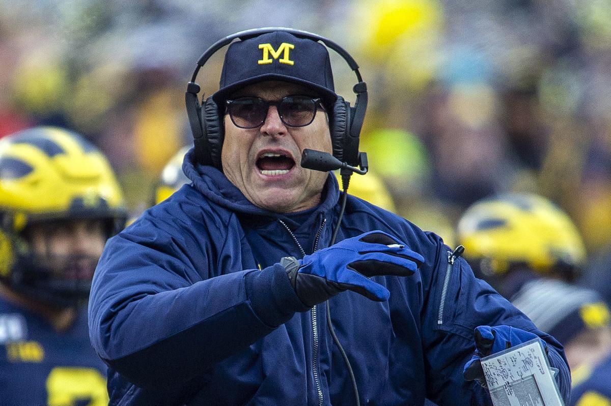 Jim Harbaugh on sidelines, AP generic file photo