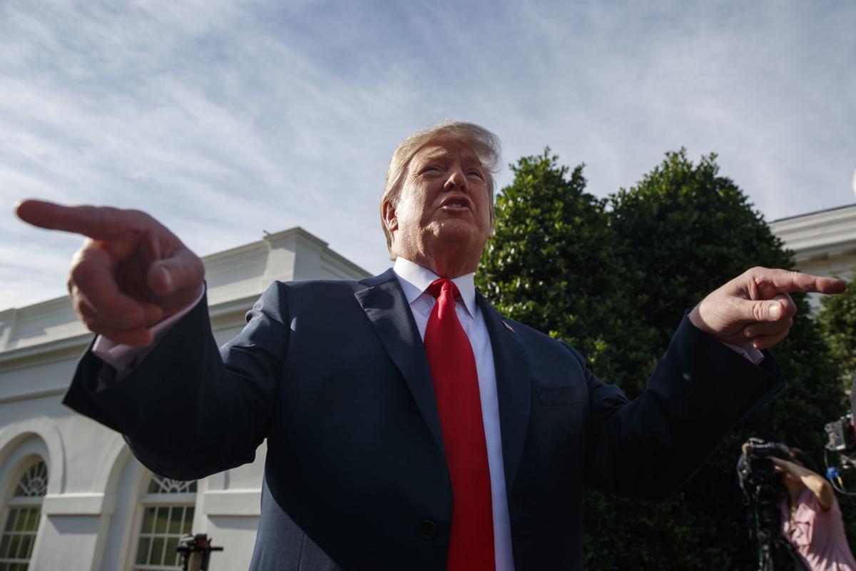 Trump talks to press on busy day (copy)