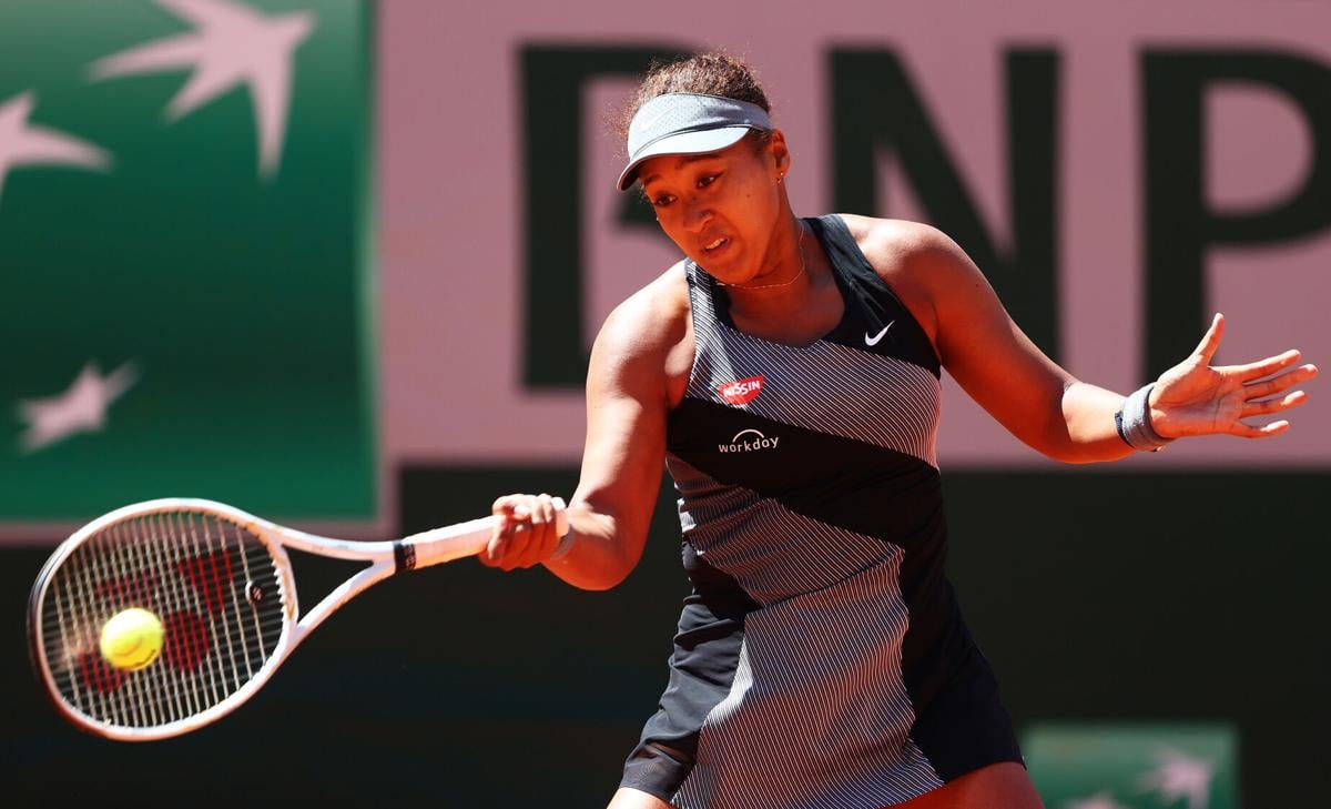 Naomi Osaka of Japan plays a forehand in her First Round match against Patricia Maria Tig of Romania during Day One of the 2021 French Open at Roland Garros on May 30, 2021 in Paris, France.
