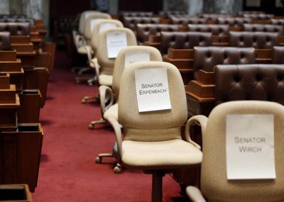 Empty chairs of Senate democrats who fled state 