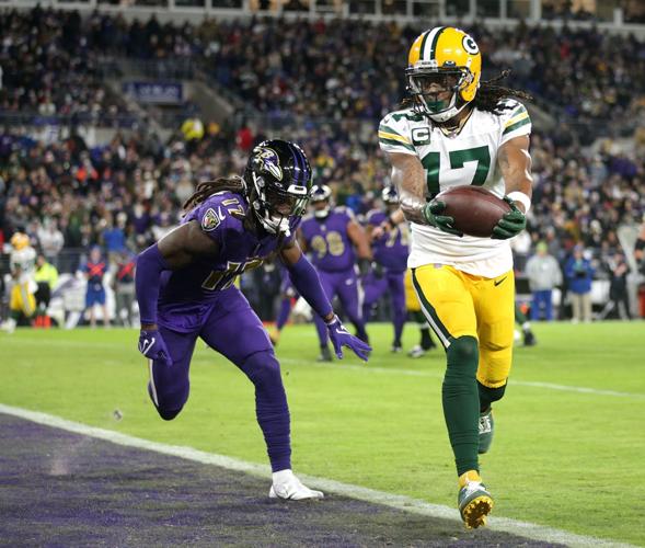 BALTIMORE, MD - DECEMBER 19: Packers wide receiver Davante Adams (17) runs  after a catch during the Green Bay Packers versus Baltimore Ravens NFL game  at M&T Bank Stadium on December 19