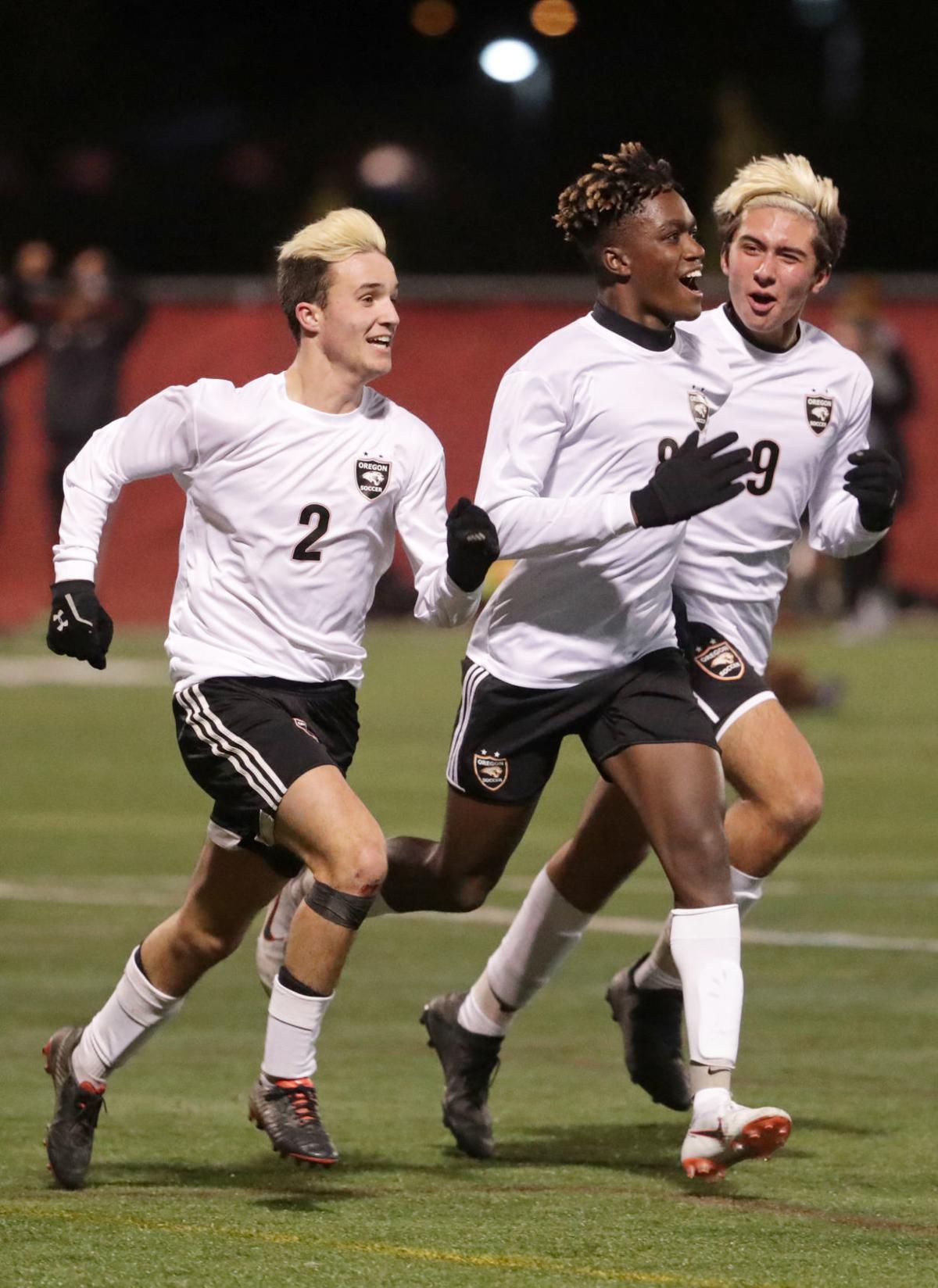 WIAA state boys soccer: Oregon players celebrate a goal against Holmen