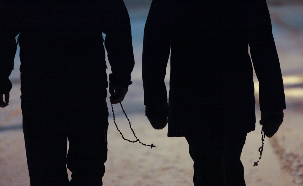 Seminarians walk with rosaries