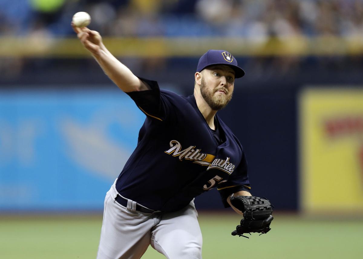Jimmy Nelson pitching, AP photo