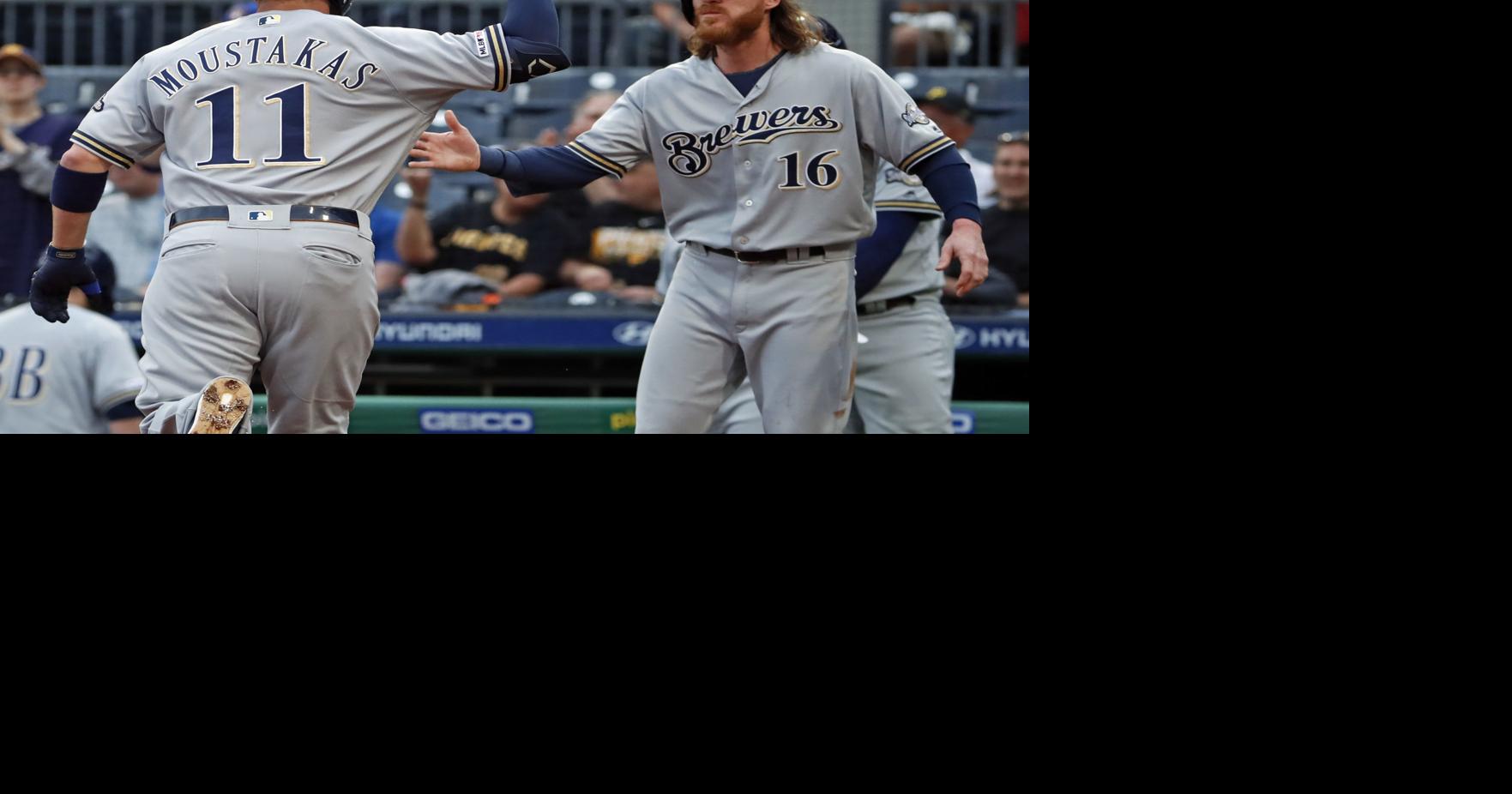 Brewers Travis Shaw is greeted by Christian Yelich at home plate