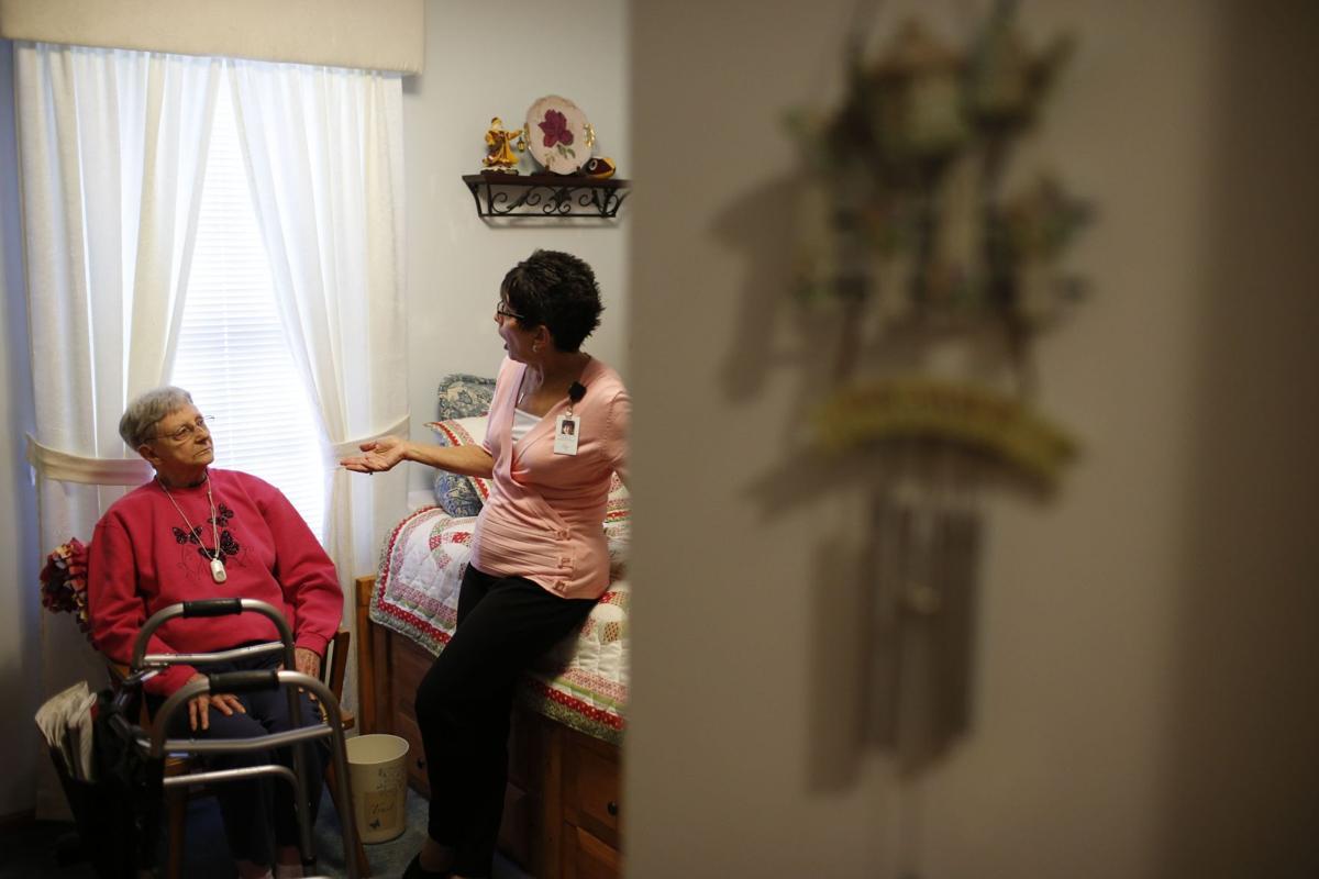 Nurse Sandy Miller, right, chats July 19 with patient Martha Hays (copy)