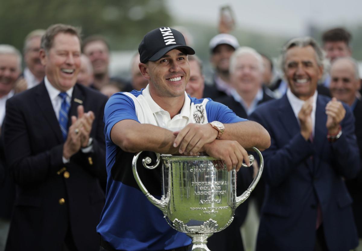 Brooks Koepka with Wanamaker Trophy, AP photo