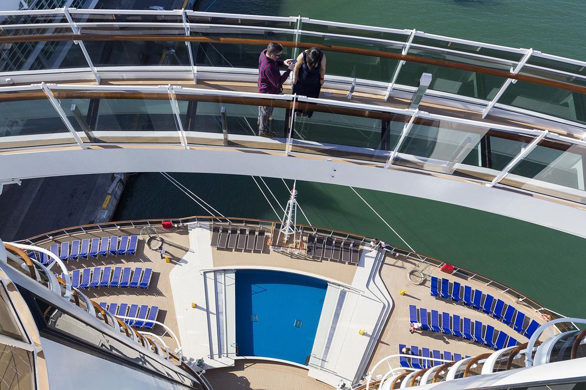 Jorge Jimenez, 43, and his wife, Yomari Jimenez, 38, walk across the "Bridge of Sighs" on MSC Cruises' newest ship, Seaside, as it was docked at PortMiami on Friday, Dec. 22, 2017. The cruise ship has various restaurants, digital displays adorning its atrium and a zipline among other amenities guests can enjoy.