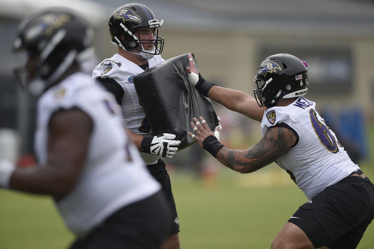 Las Vegas Raiders fullback Alec Ingold (45) talks with New Orleans Saints  linebacker Zack Baun …