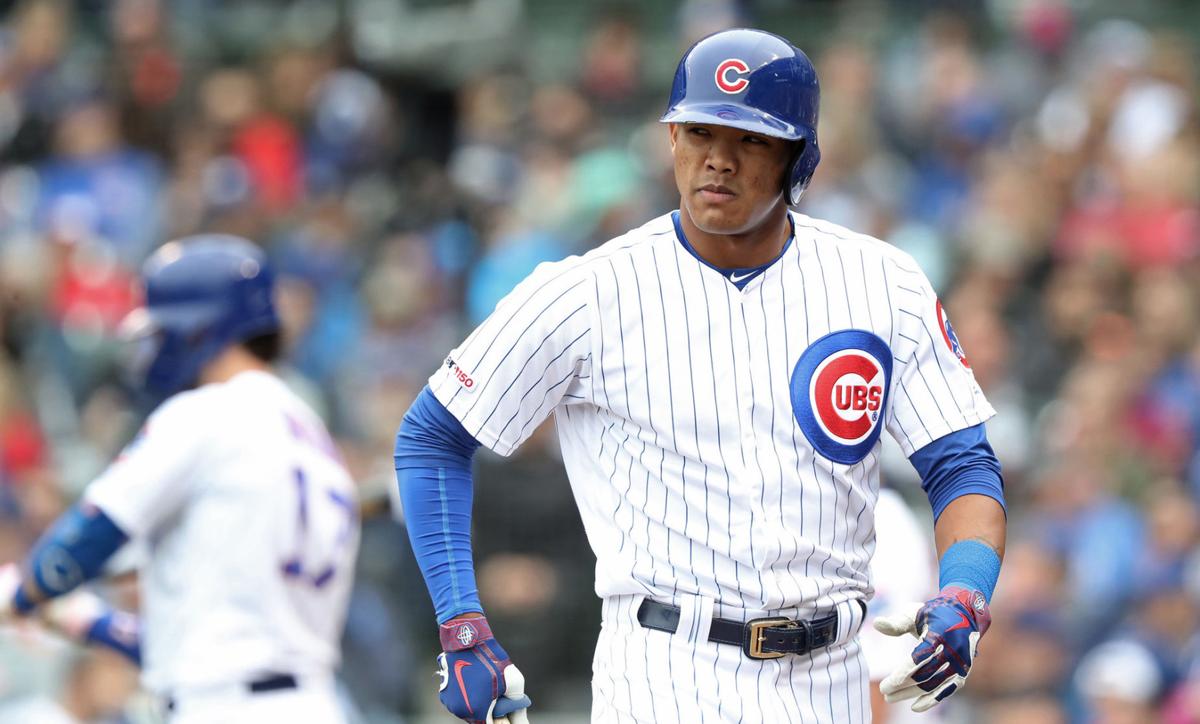 Chicago Cubs shortstop Addison Russell heads to the dugout after striking out in the seventh inning against the Cincinnati Reds on Friday, May 24, 2019 at Wrigley Field in Chicago. Russell was not tendered a contract by the Cubs Monday night.