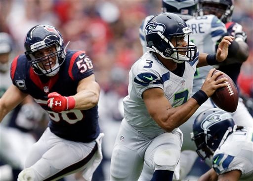 NFL: Seahawks' Russell Wilson puts on his running shoes to beat J.J. Watt,  Texans