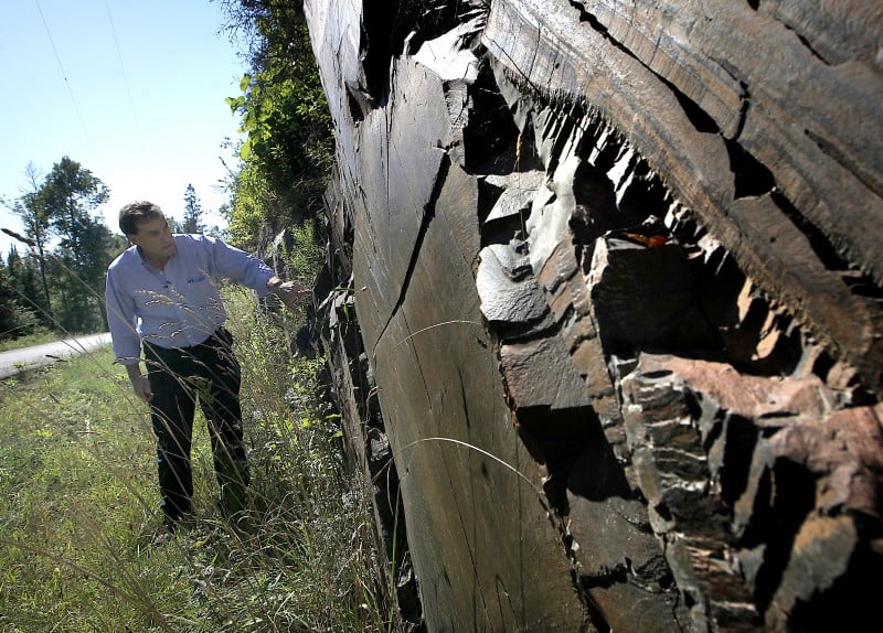 Mining in Wisconsin, Gogebic Taconite president Bill Williams checking out ore