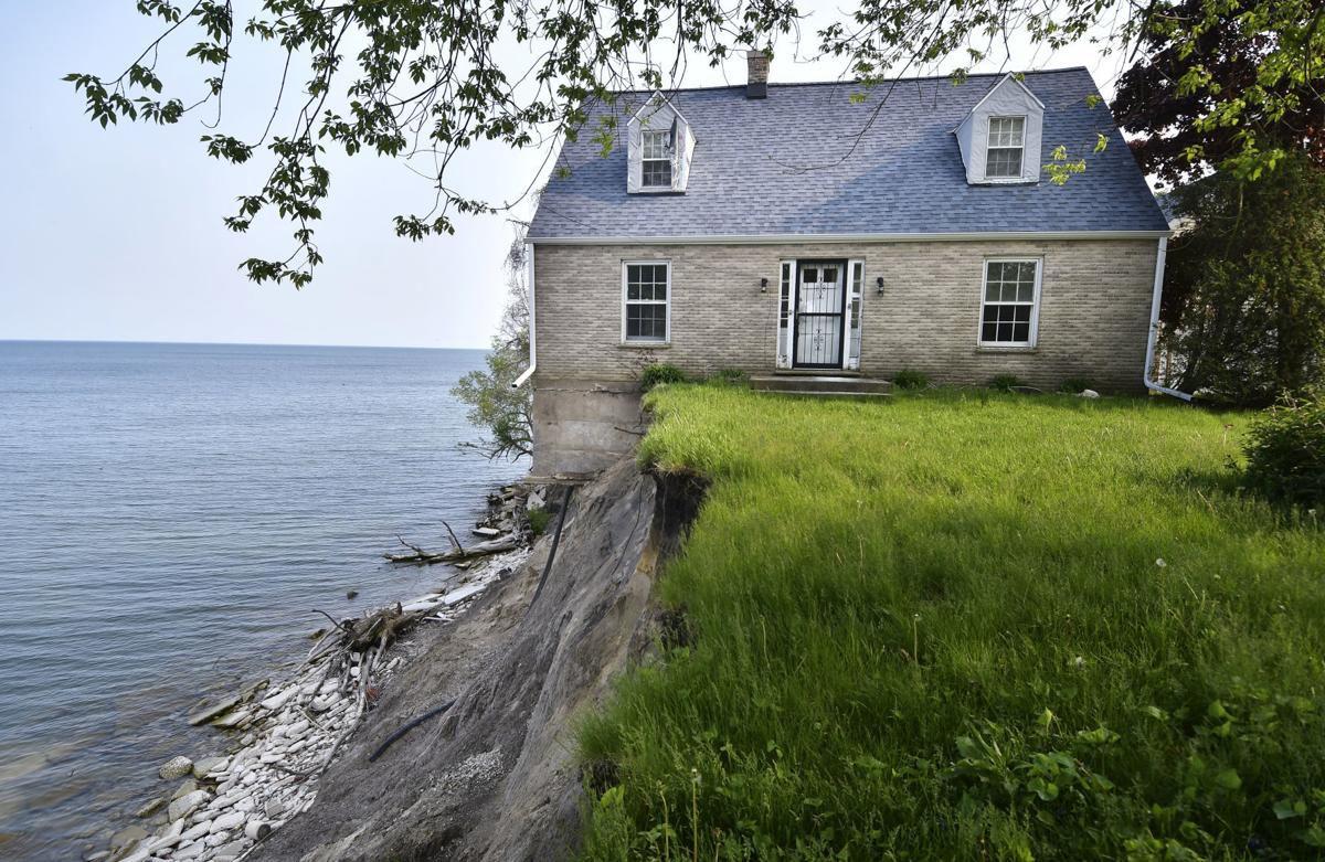 Home teetering on Lake Michigan's eroding shoreline headed into