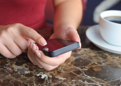 woman uses smartphone mobile phone istock photo