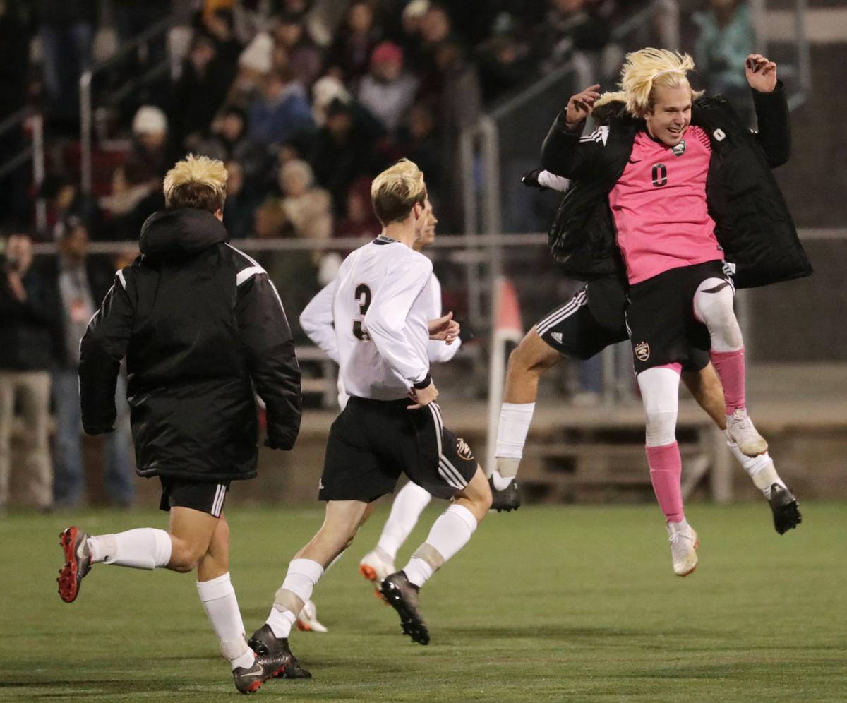 WIAA state boys soccer: Duncan Morgan leads the celebration after Oregon's victory