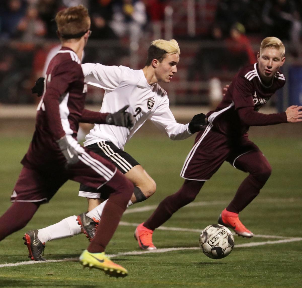 WIAA state boys soccer: Oregon's Collin Bjerke works through the Holmen defense