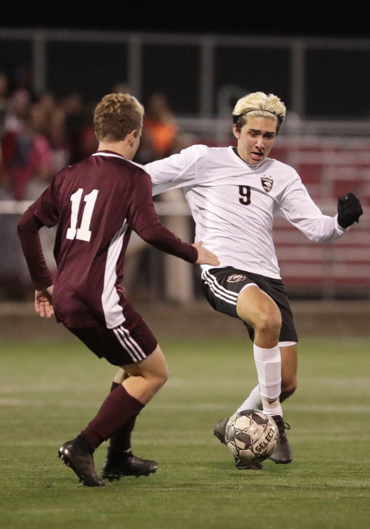 WIAA state boys soccer: Oregon's Zach Folmer against Holmen's Kyle Palmberg