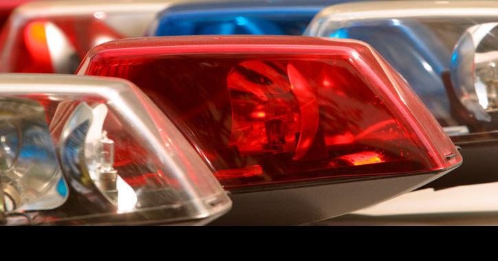 Sand-filled dump truck tips over, driver extricated