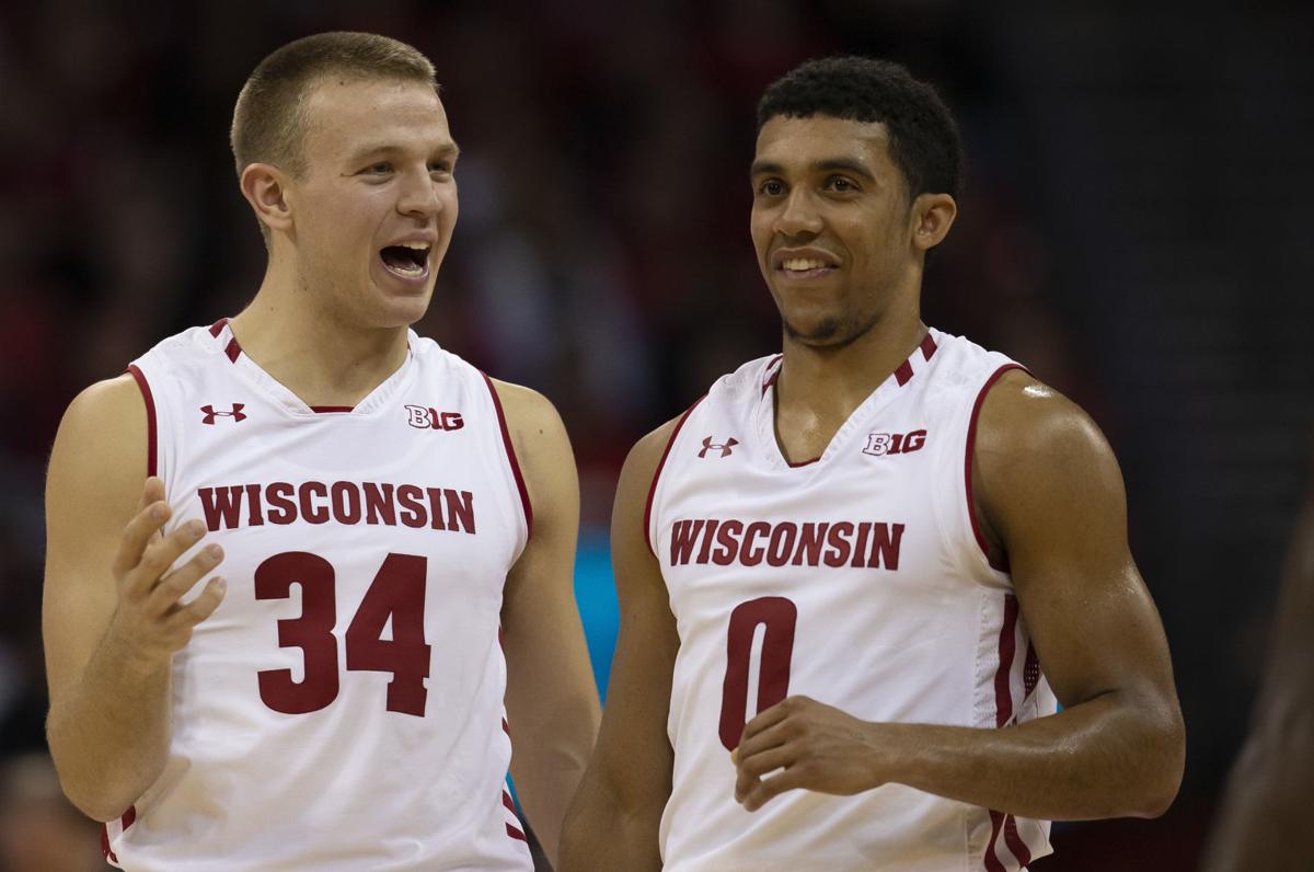 Brad Davison, D'Mitrik Trice photo
