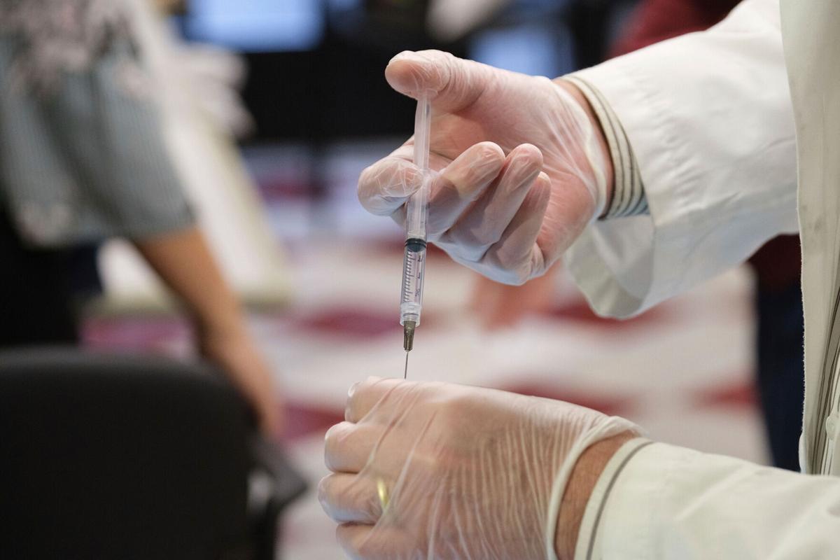 One week into distribution, pharmacies have a familiar request: 'We just need more vaccines'
