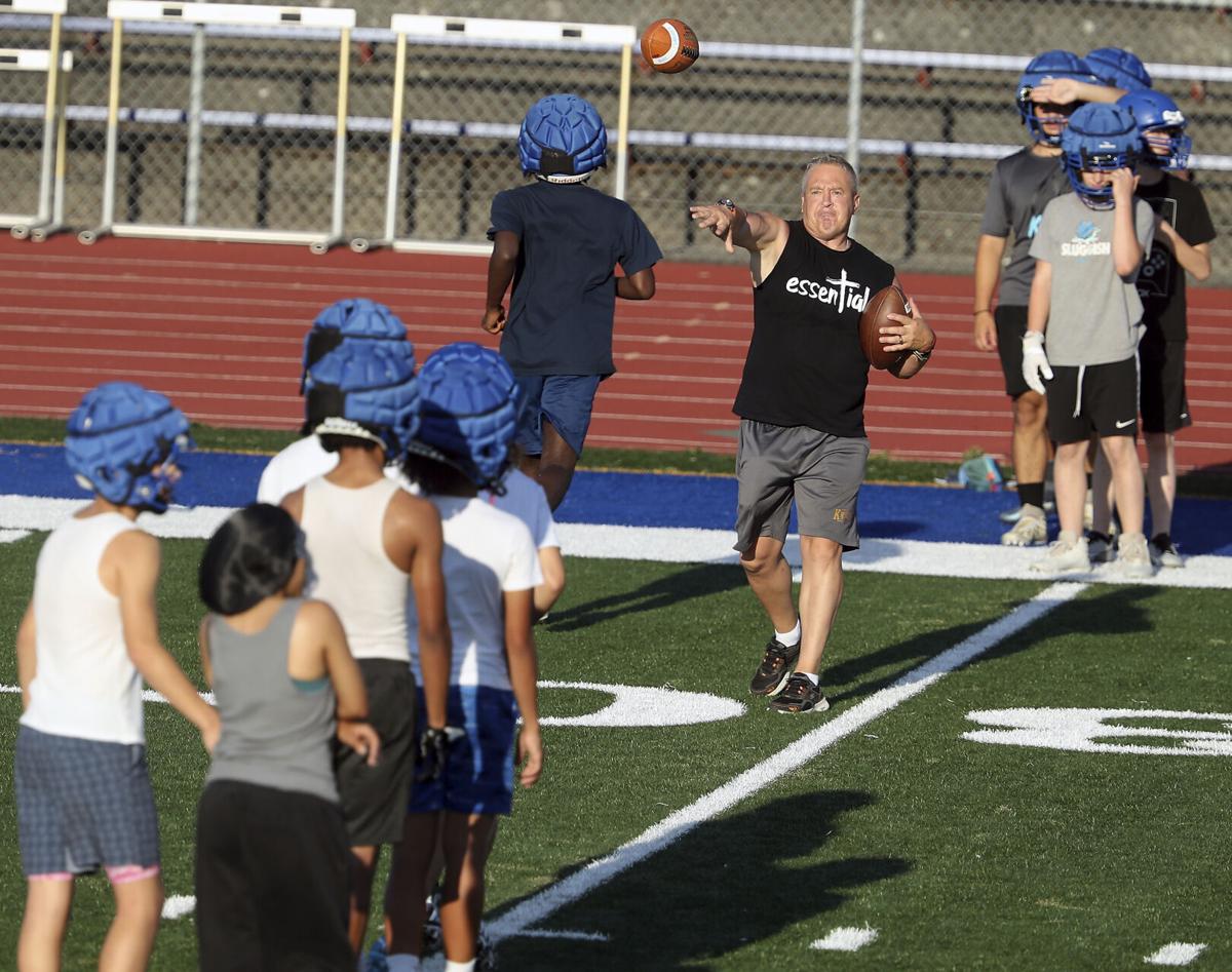 Praying high school football coach finally gets his job back