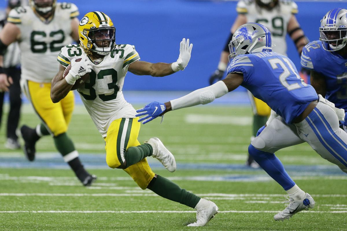 Green Bay Packers cornerback Jaire Alexander (23) breaks up a pass intended  for wide receiver Allen Lazard (13) during an NFL football training camp at  Lambeau Field Saturday, Aug. 7, 2021, in