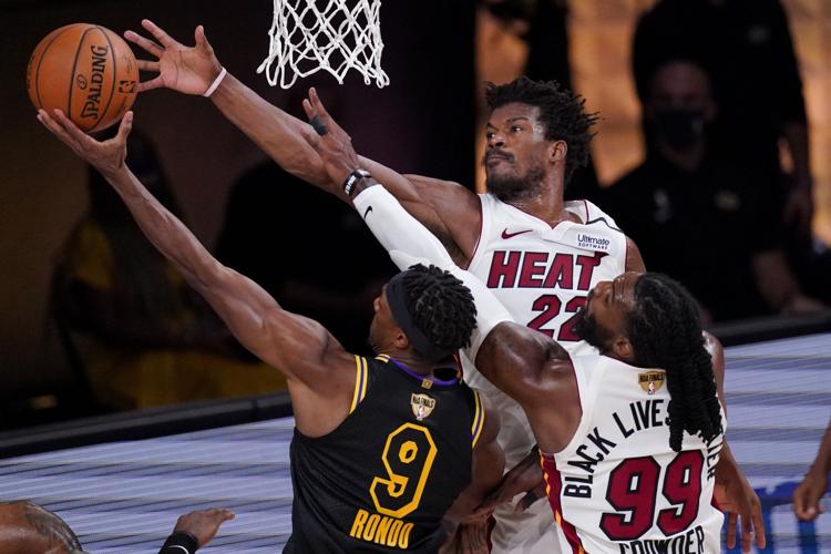 Miami Heat forward Jimmy Butler plays during the second half in Game 4 of  basketball's NBA Finals against the Los Angeles Lakers Tuesday, Oct. 6, 2020,  in Lake Buena Vista, Fla. (AP