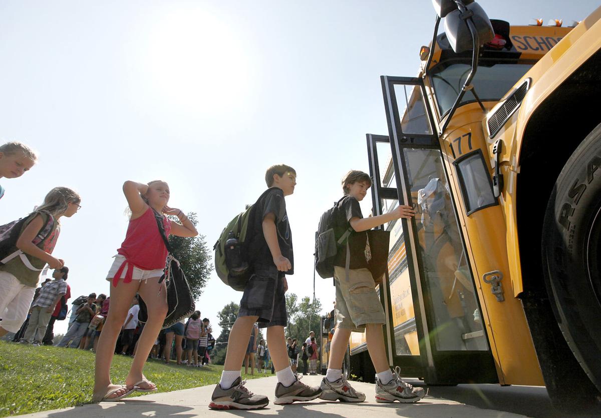 Kids getting on school bus