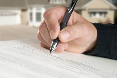 Title insurance mortgage document contract signature istock file photo