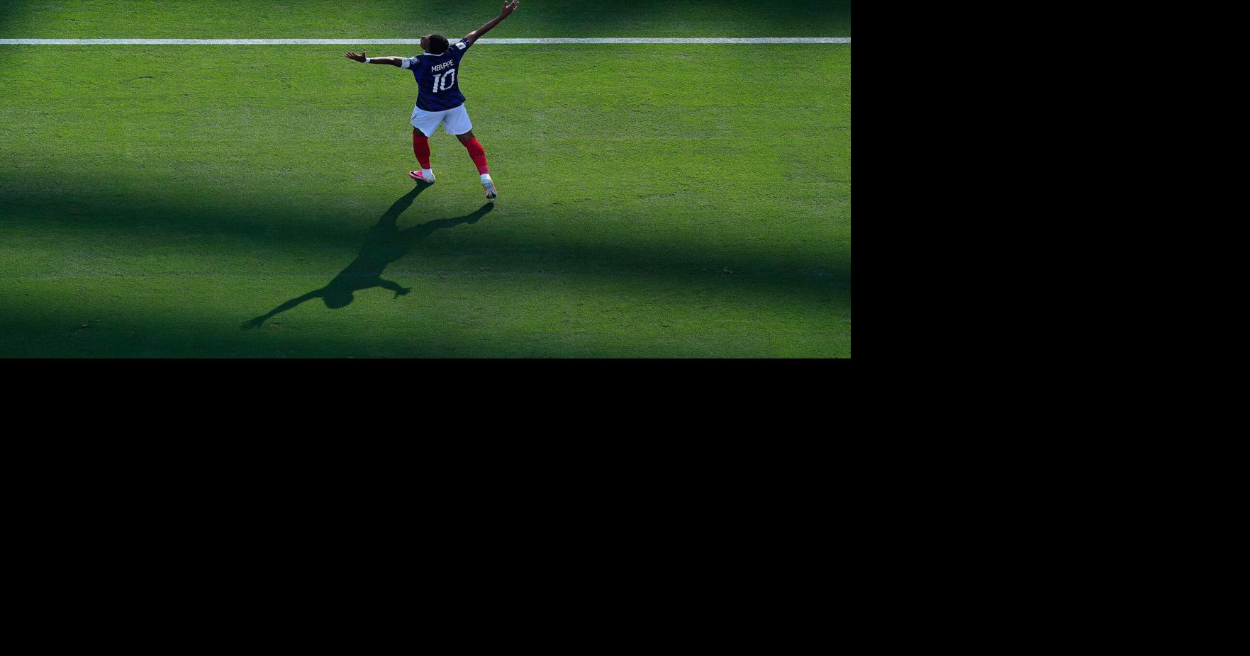 One Extraordinary Photo: France's Kylian Mbappe stands alone Shooting from a catwalk can be tricky, even for a veteran photographer like the AP's Petr Josek