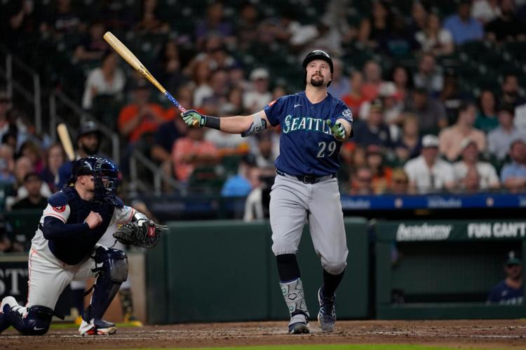 Mariners' scuffling star catcher Cal Raleigh placed on 10-day injured ...