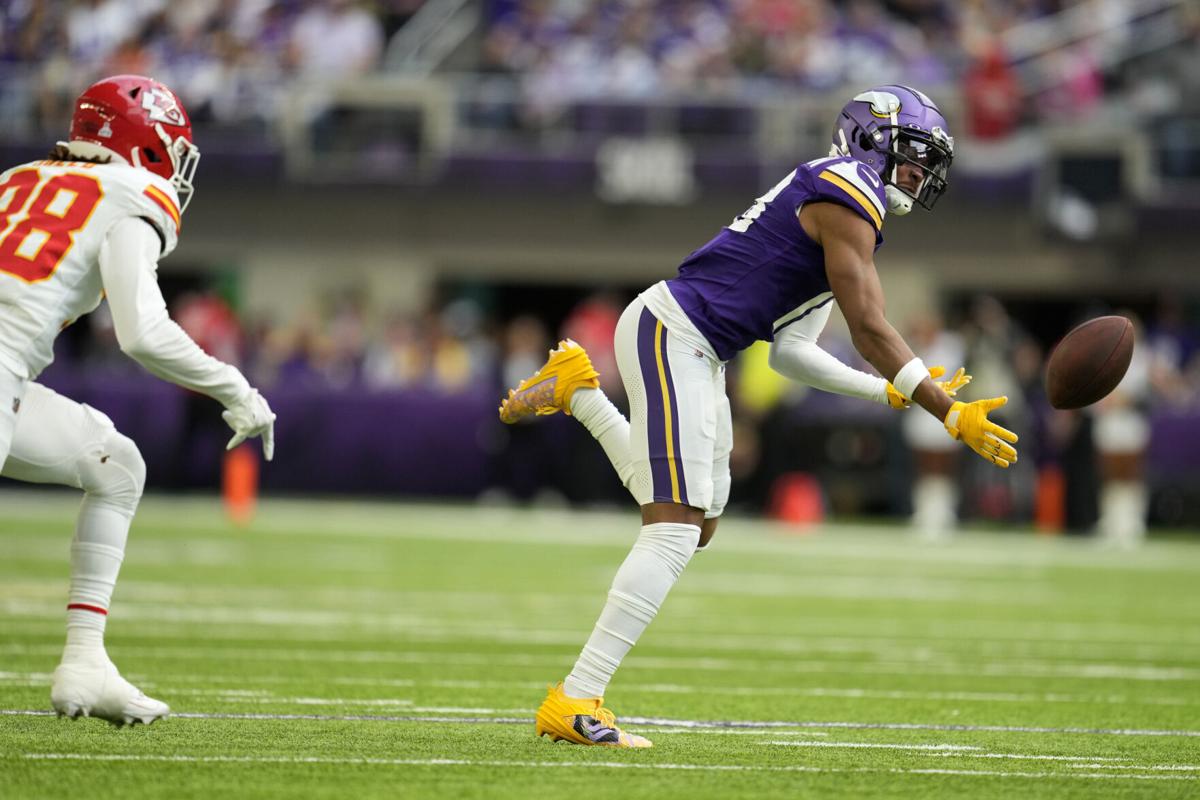 Minnesota Vikings wide receiver Justin Jefferson (18) talks with Arizona  Cardinals players after a NFL preseason