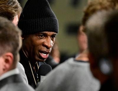 Colorado Buffaloes head coach Deion Sanders answers questions on the gold carpet for the Sports Illustrated Sportsman of the Year and Coach Prime Season World Premiere at the CU Events Center in Boulder, Colorado, Dec. 6, 2023.