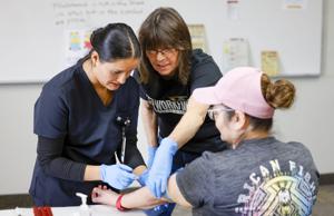 Lend us your arms: CSI phlebotomy students get hands-on practice