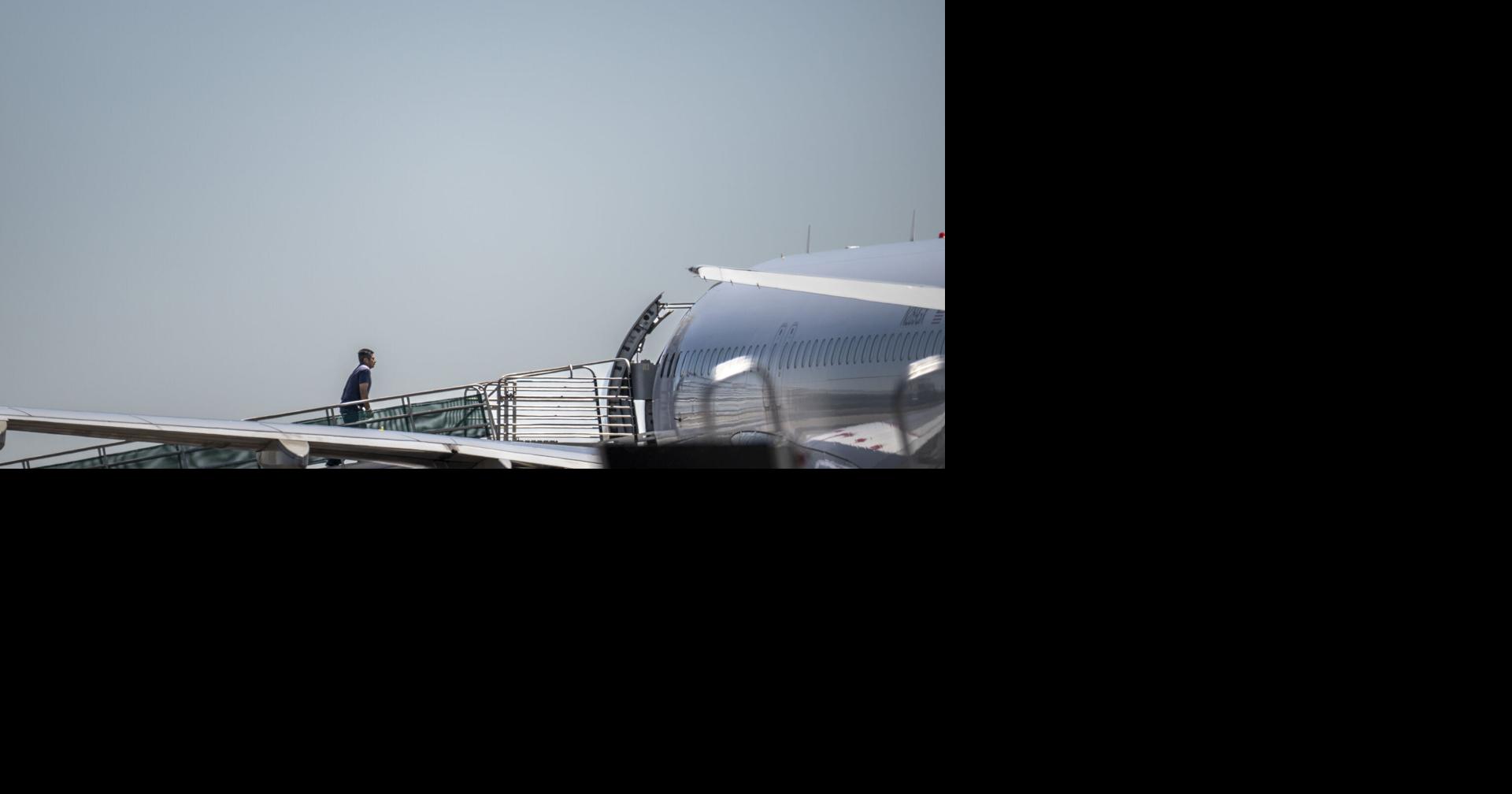 Detainees board plane at Joslin Field