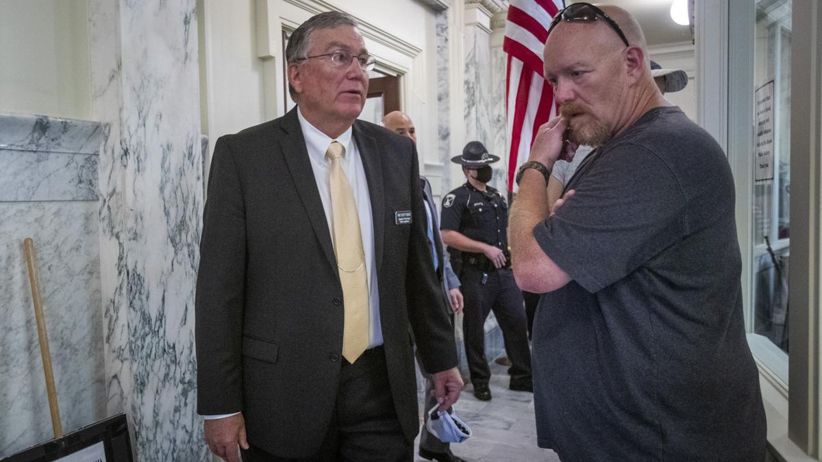 Crowd shatters glass to get to Idaho House session on virus