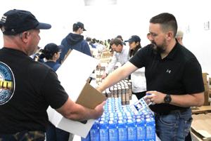Chobani packs food boxes for 'Let's Eat Week'