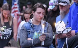 “We cannot let the darkness win,” hundreds gather at vigil