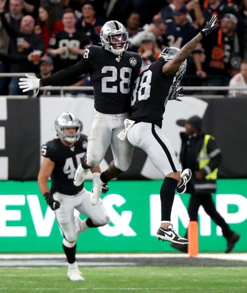 Oakland Raiders running back Josh Jacobs (28) celebrates with teammates after scoring the go-ahead touchdown in the fourth quarter of a game against the Chicago Bears Sunday, Oct. 6, 2019 at Tottenham Hotspur Stadium in London, UK.