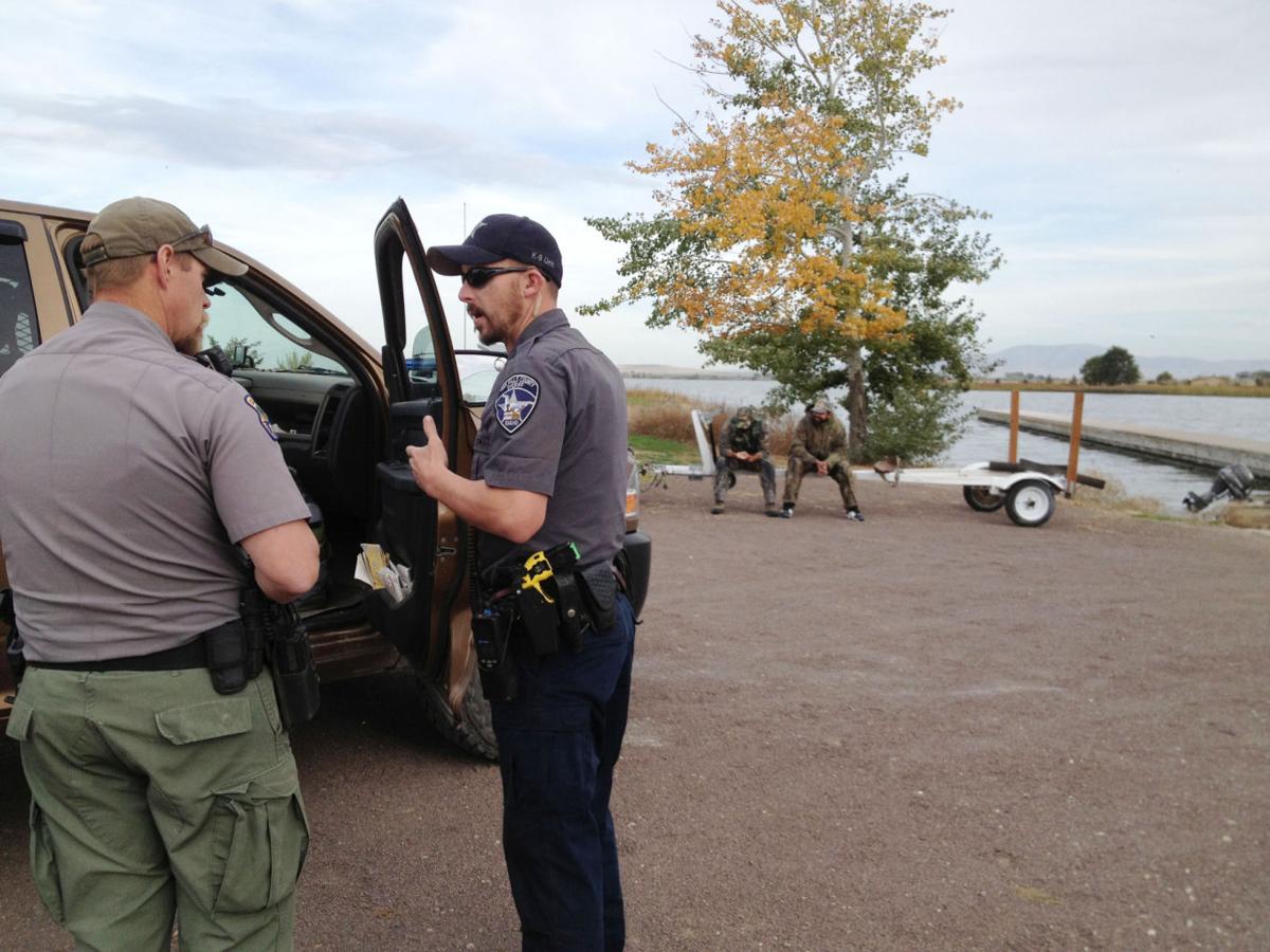Gallery Fish and Game Officer Investigates Local