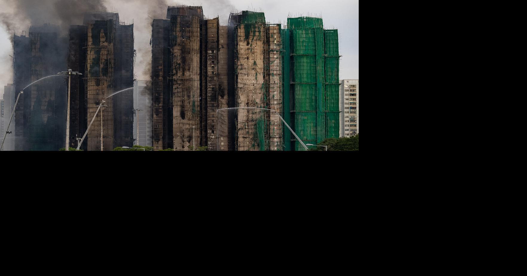 At least 94 dead as Hong Kong firefighters battle burning towers for a second day